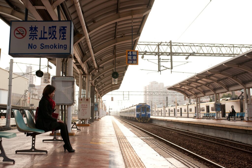 a woman waiting at a train station